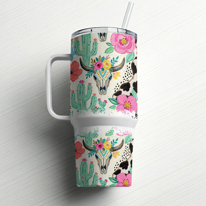 Tumbler with skull, cactus, and floral western-themed pattern.