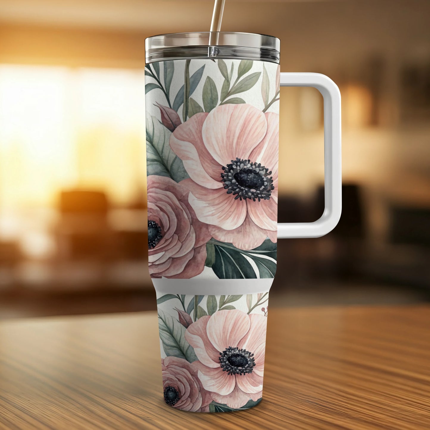 Tumbler with floral pattern of pink roses and green leaves.