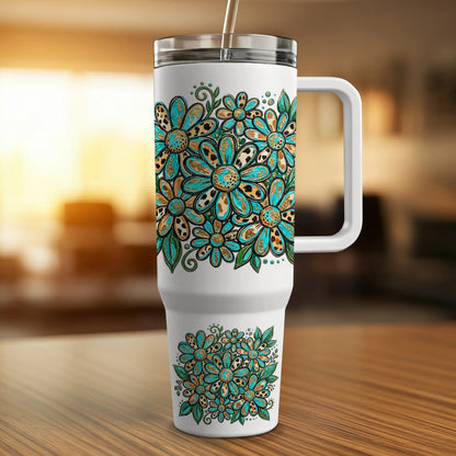 White tumbler with a floral pattern of blue, teal, and gold flowers.
