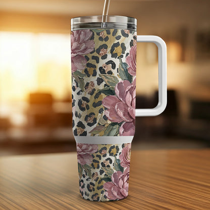 Floral and leopard print tumbler with handle and straw.