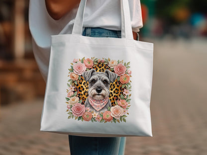 White tote bag featuring a schnauzer portrait framed by flowers.