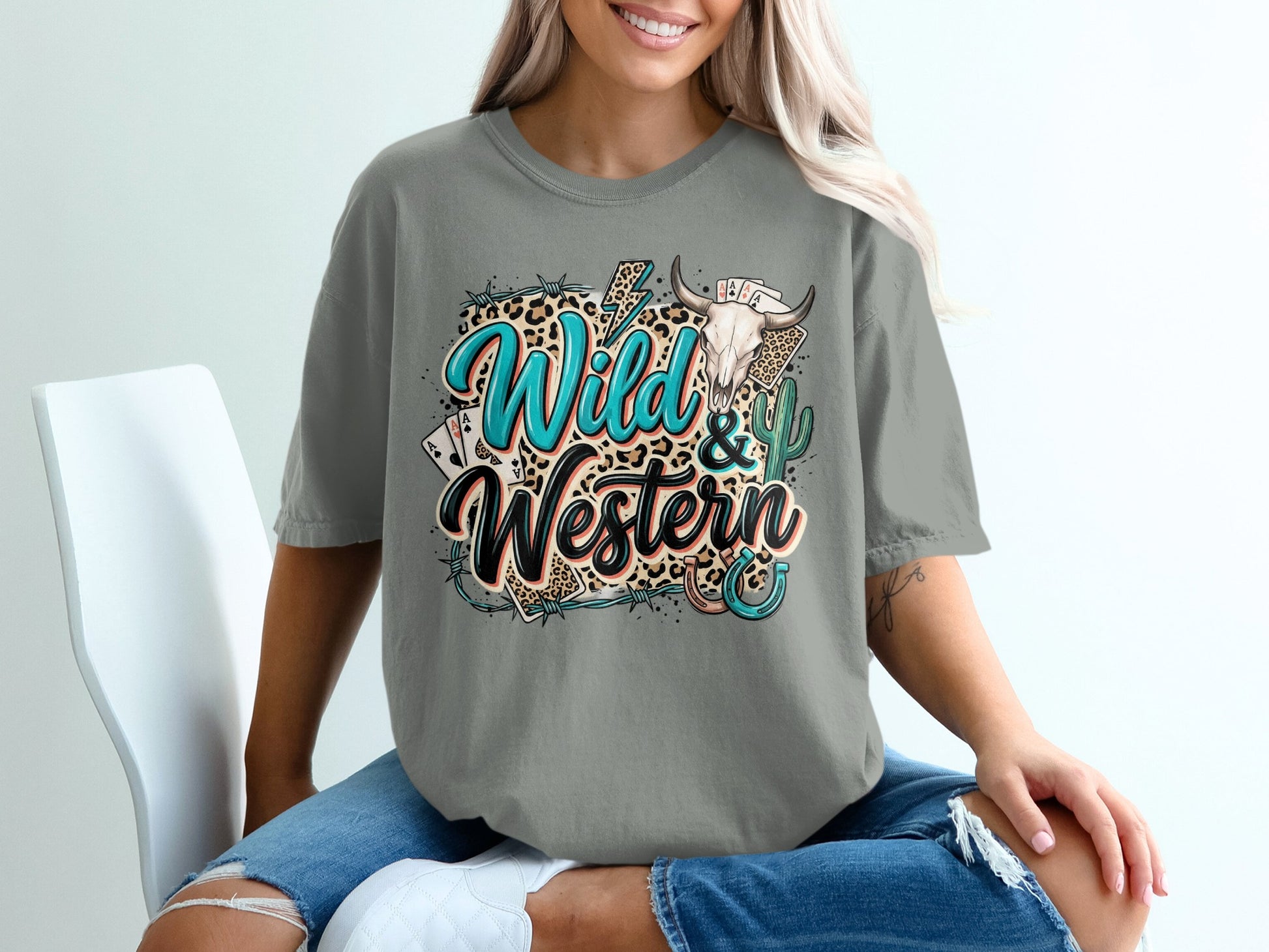 Grey t-shirt with "Wild & Western" text, bull skull, cactus, and cards.