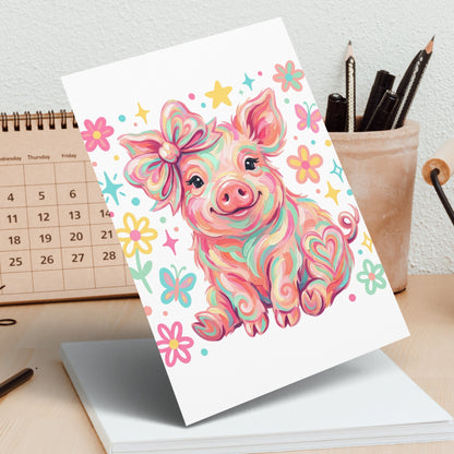 Whimsical pig with colorful bow and floral accents on a card.