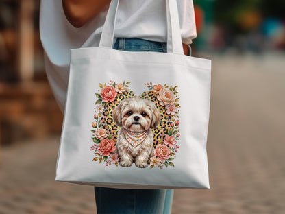 White tote bag with a fluffy dog, leopard print heart, and floral accents.