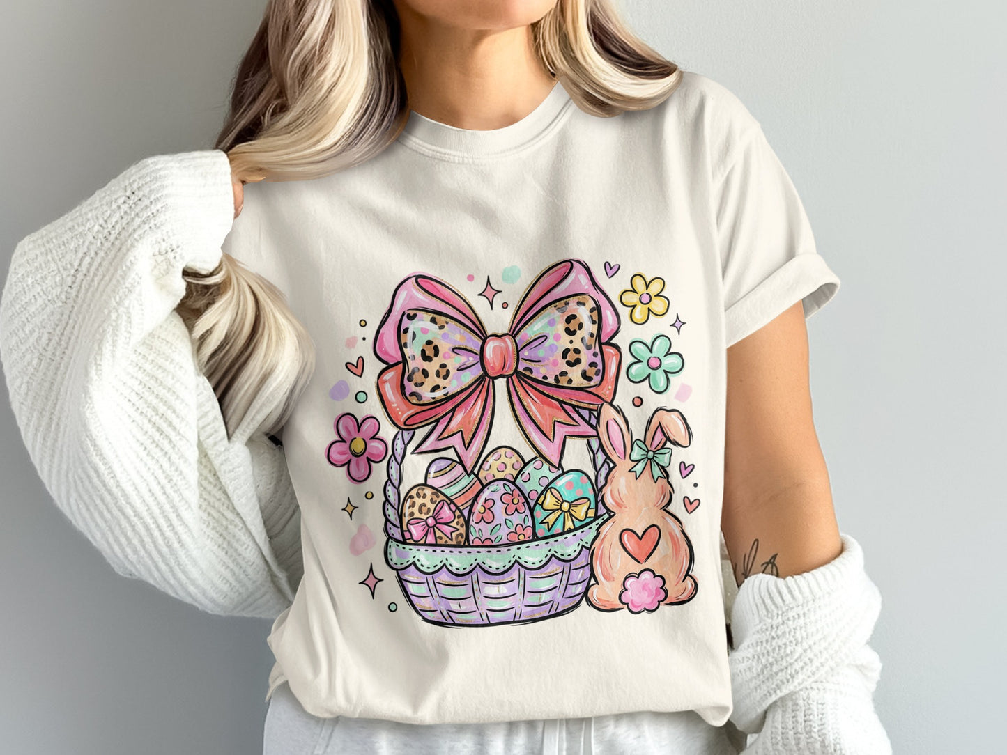 Easter basket with painted eggs, bow, and bunny.