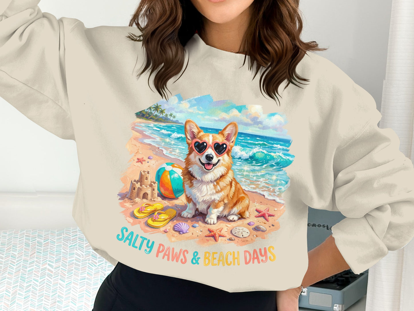 Corgi wearing heart sunglasses on a beach with "Salty Paws & Beach Days" text.