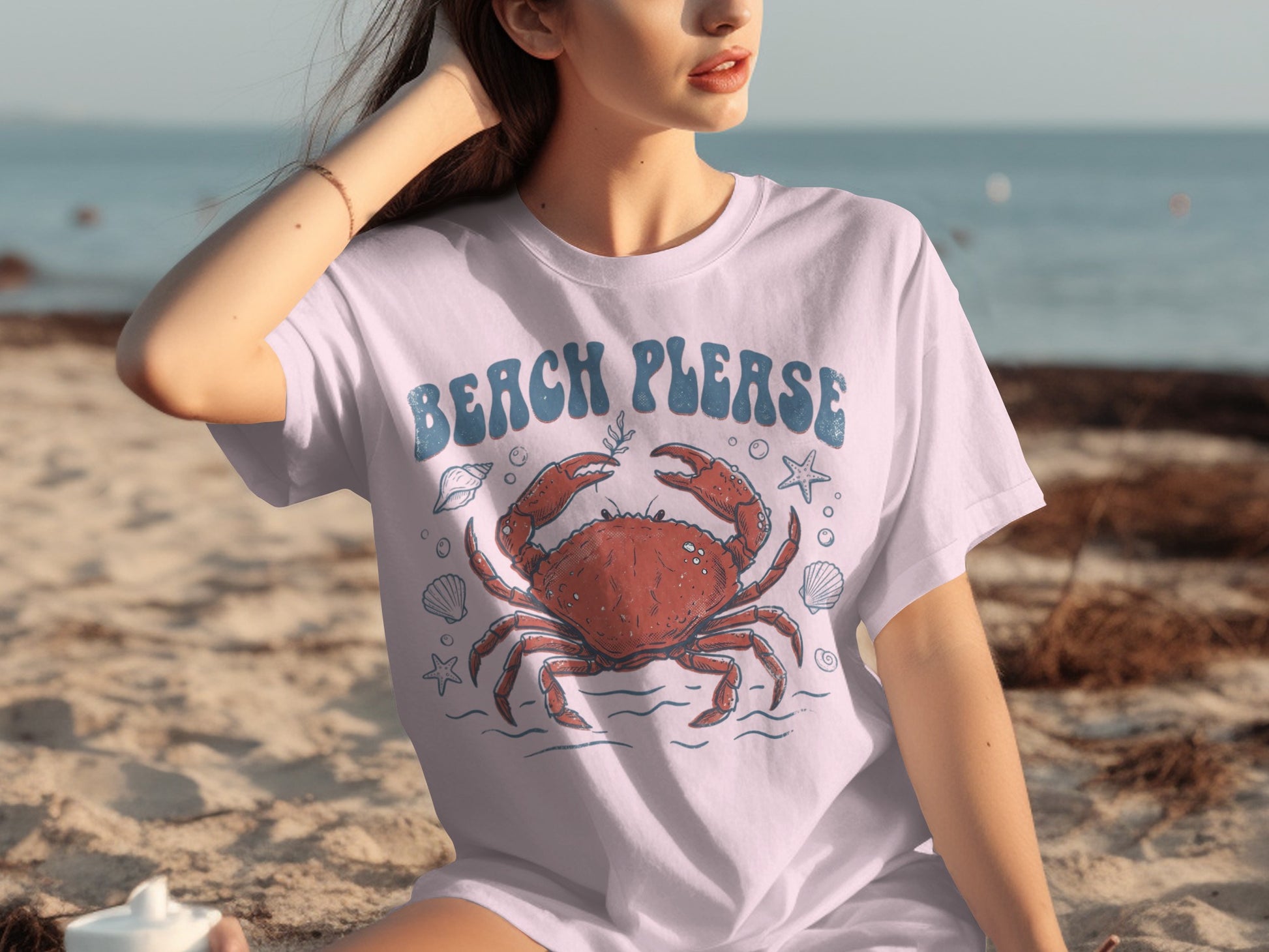 White t-shirt with blue "BEACH PLEASE" text and a red crab graphic.