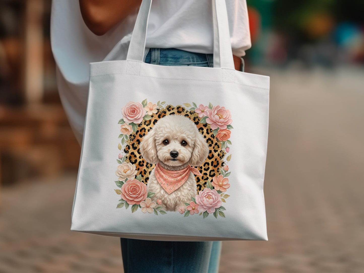 White tote bag with poodle illustration surrounded by flowers and leopard print.