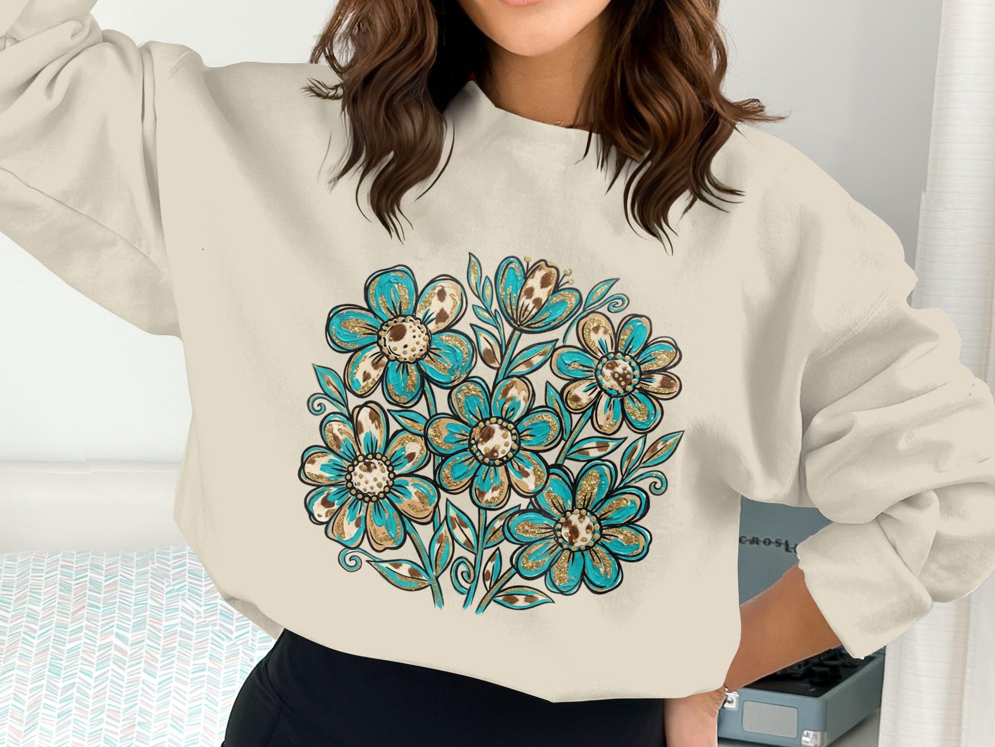 Cream sweatshirt with a blue and gold floral design on the chest.