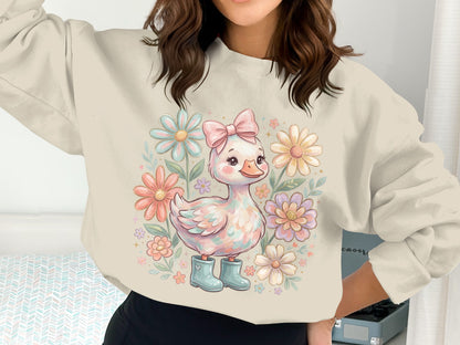 Sweatshirt with pastel duckling and flowers, featuring a pink bow.