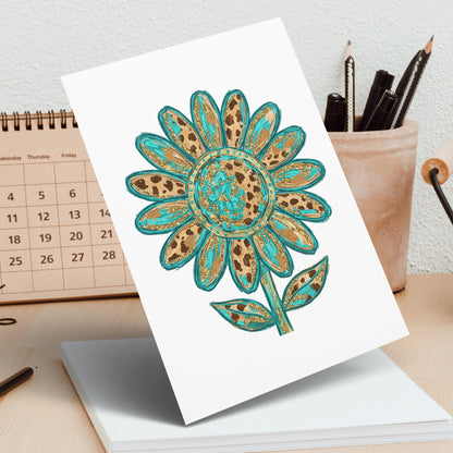 Turquoise and gold leopard print sunflower drawing on a white card.