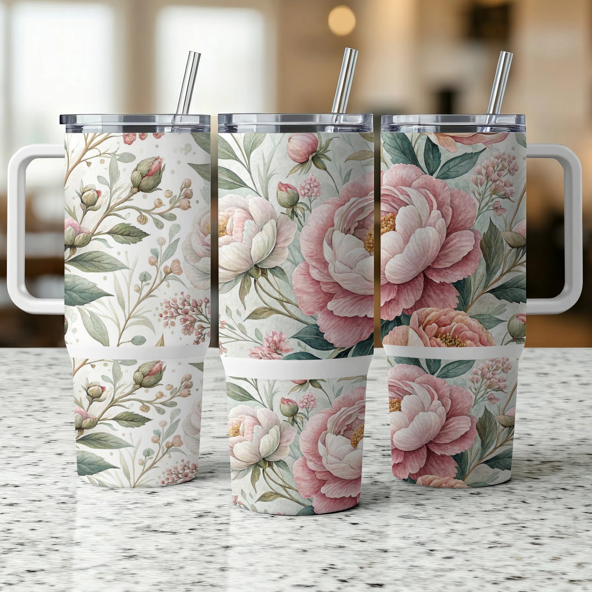 Three tumblers with pink peonies and green leaves on a speckled countertop.