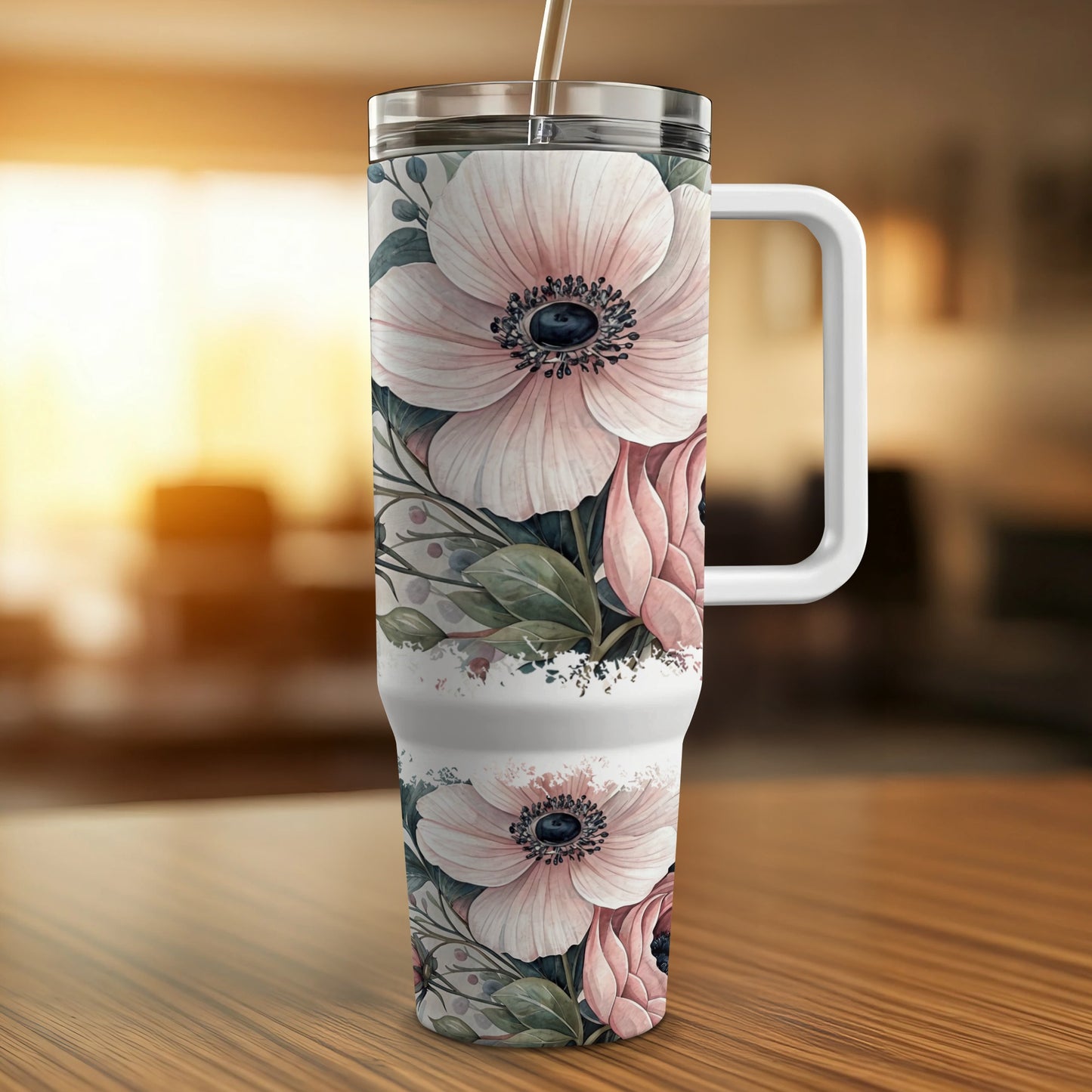 Floral patterned tumbler with lid and handle.