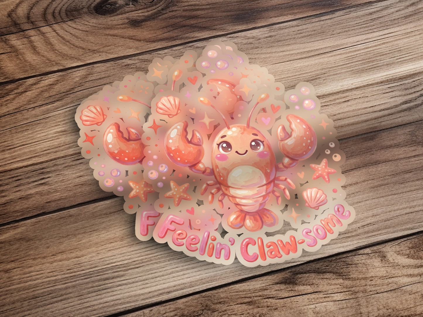 Kawaii lobster sticker with "Feelin' Claw-some" text surrounded by bubbles and shells.