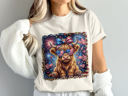 Highland cow wearing sunglasses and a bow, with fireworks and American flags.