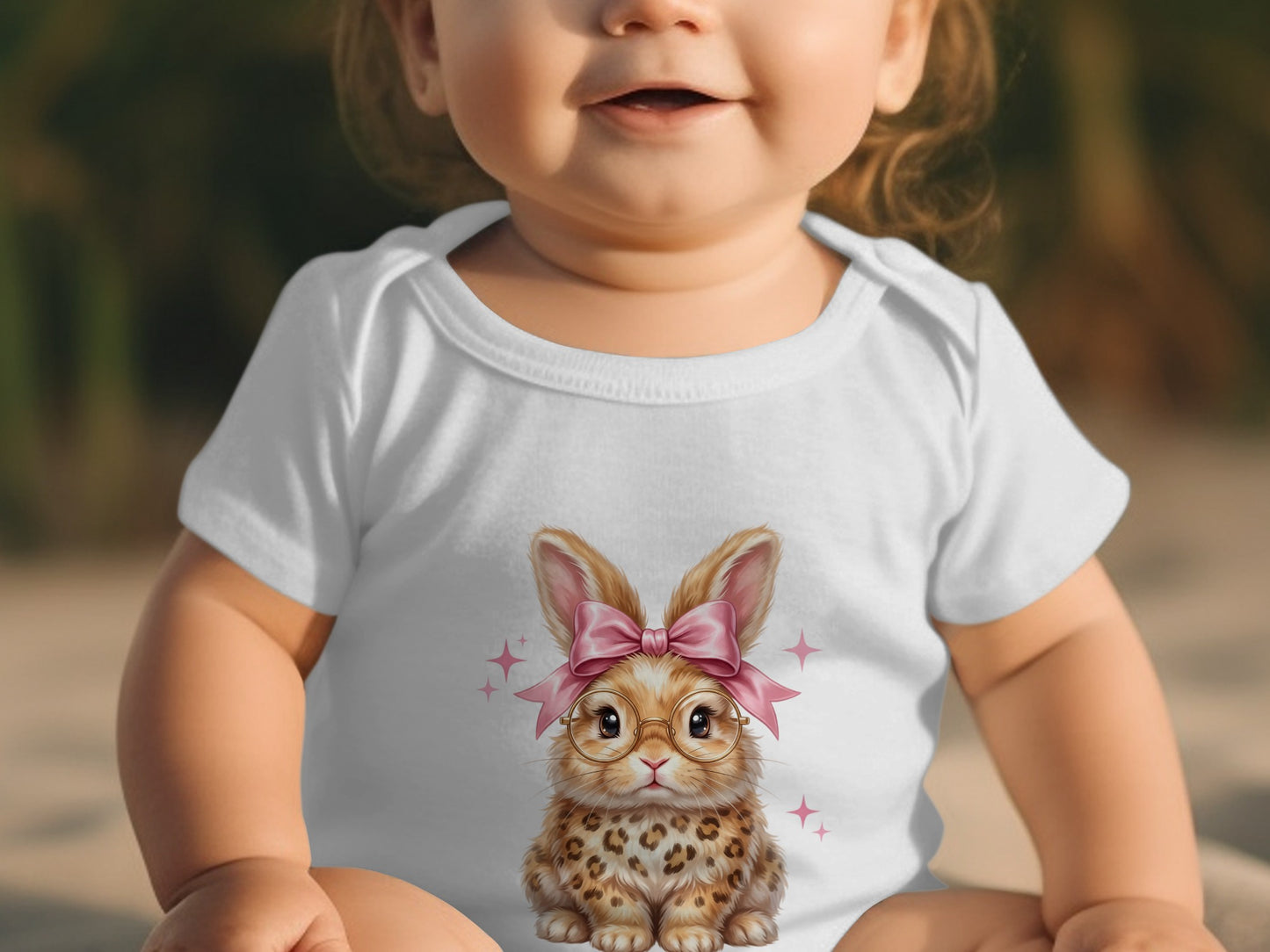 White baby bodysuit with a cartoon bunny wearing glasses and a pink bow.