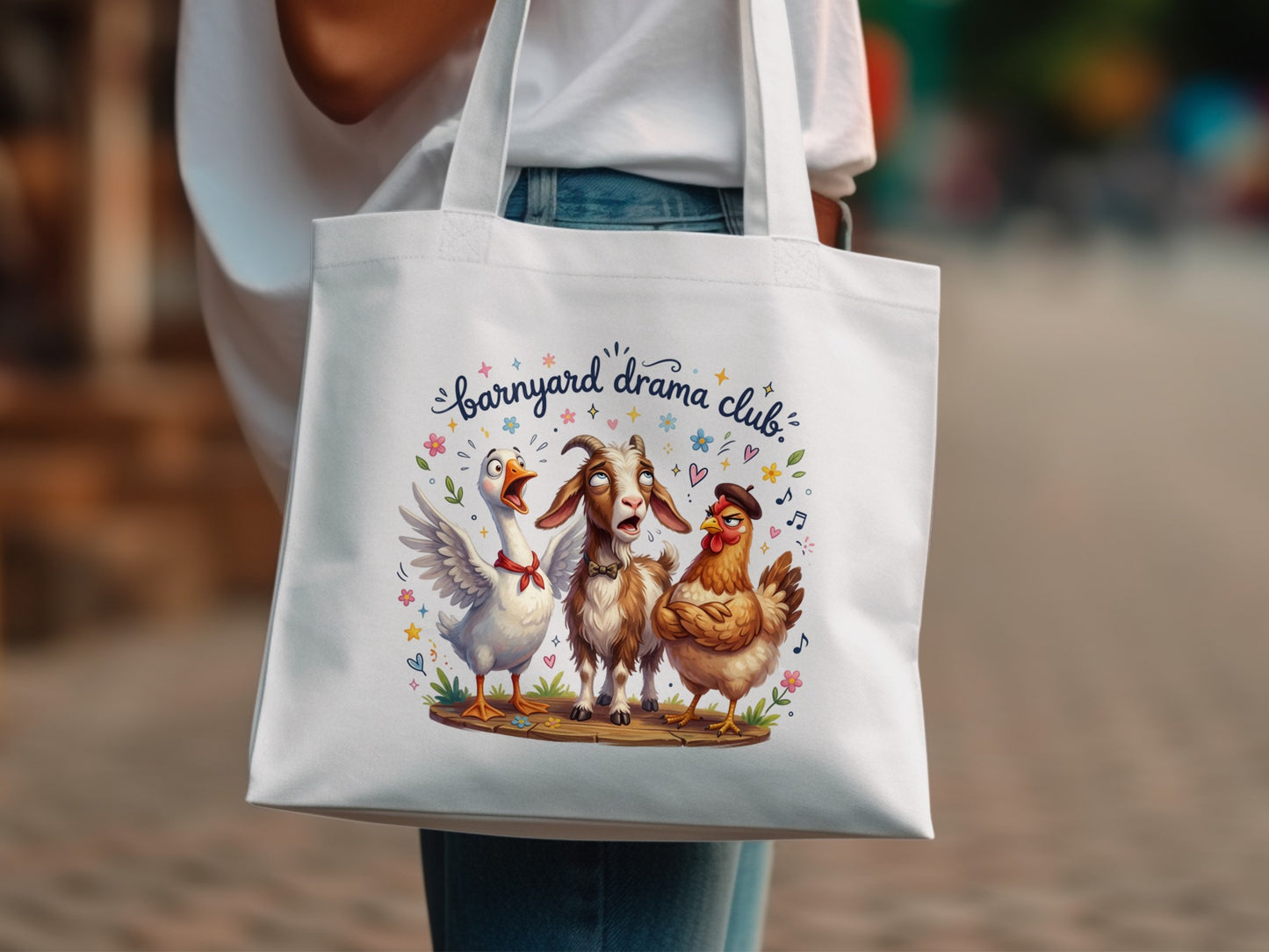 Barnyard Drama Club tote bag with a goat, goose, and chicken graphic.