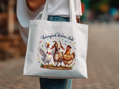 Barnyard Drama Club tote bag with a goat, goose, and chicken graphic.