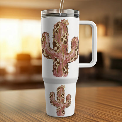 White tumbler with a pink and gold patterned cactus design.