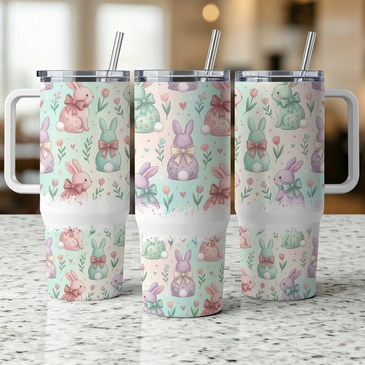 Three white tumblers with pastel Easter bunny and floral pattern.