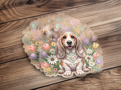 Basset hound with bandana surrounded by pastel flowers and butterflies.