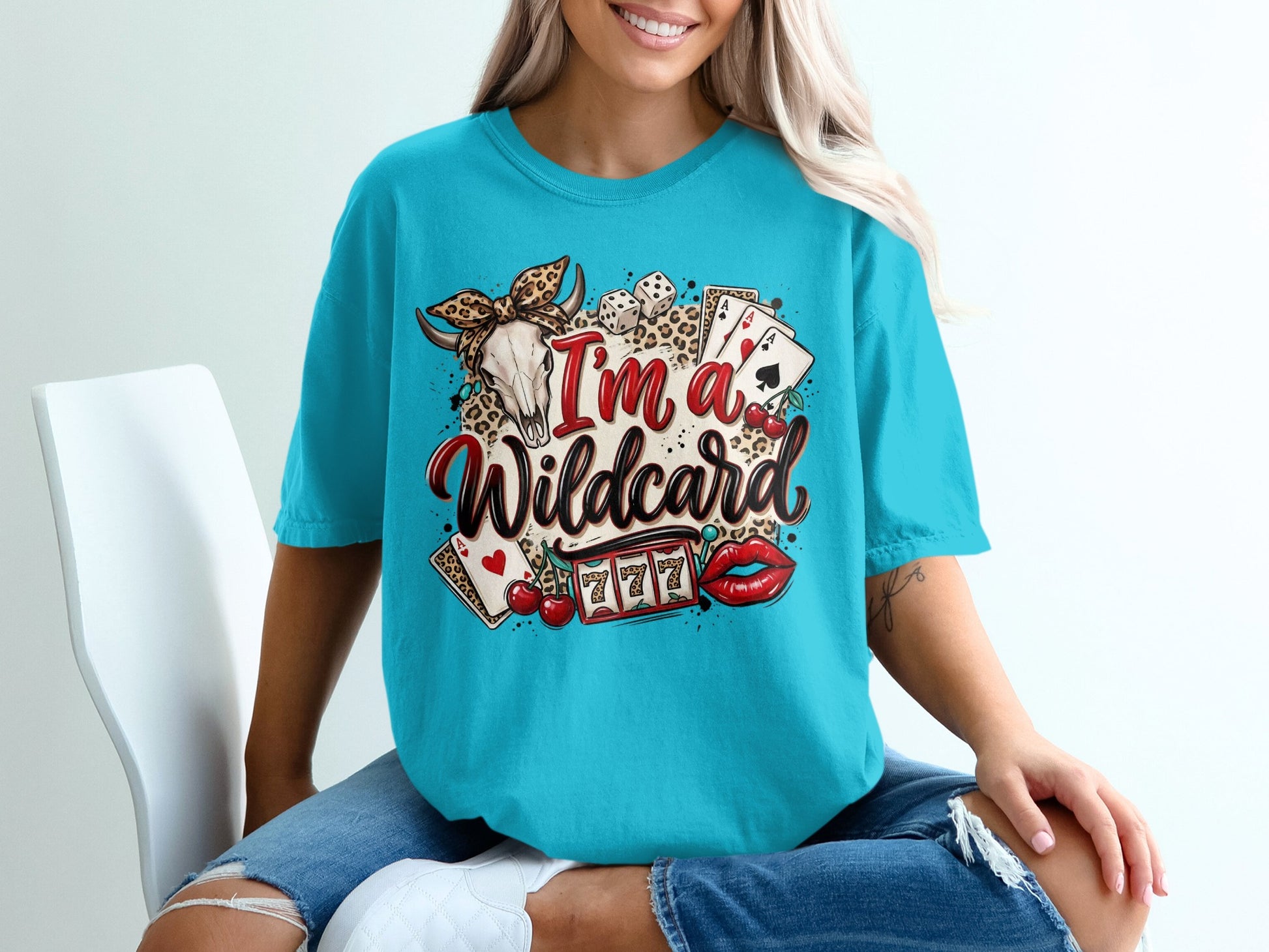T-shirt with "I'm a wildcard" text, skull, dice, cherries, and slot machine.