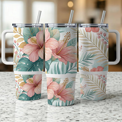 Three tumblers with floral and leaf patterns on a speckled counter.