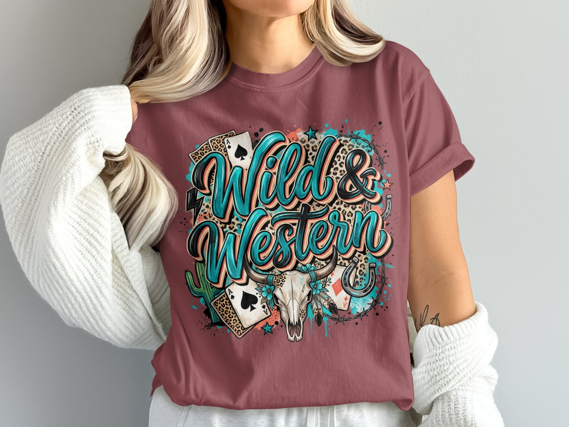 Wild & Western text with playing cards, skull, and horse shoe design.