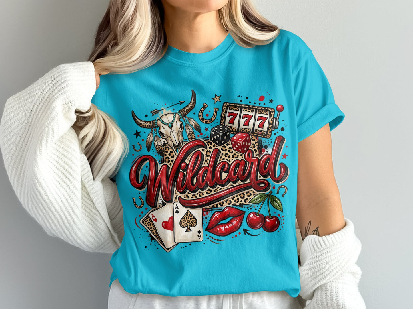 Turquoise t-shirt with "Wildcard" graphic featuring a skull, dice, cherries, and playing cards.