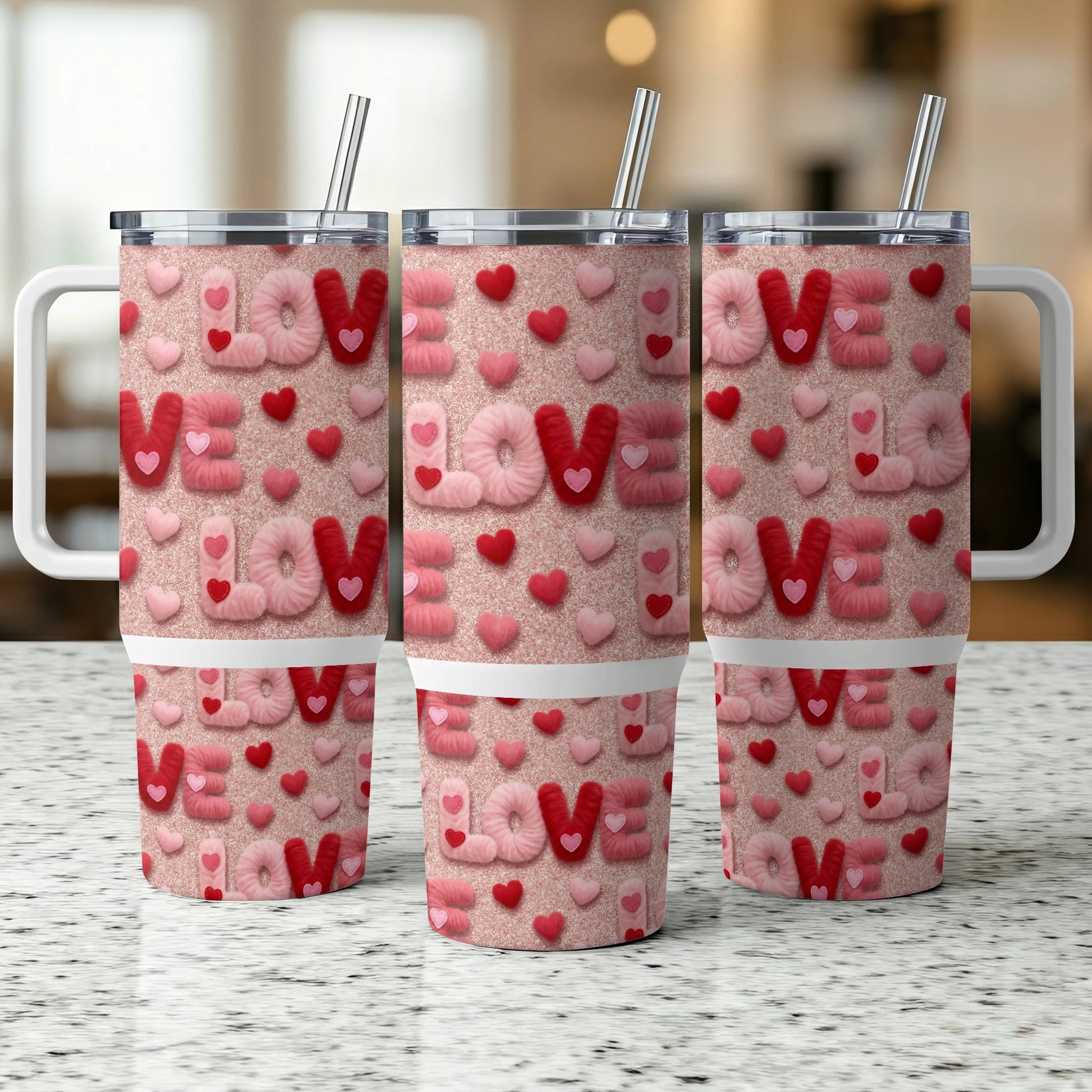 Three tumblers with pink glitter, hearts, and the word "LOVE".