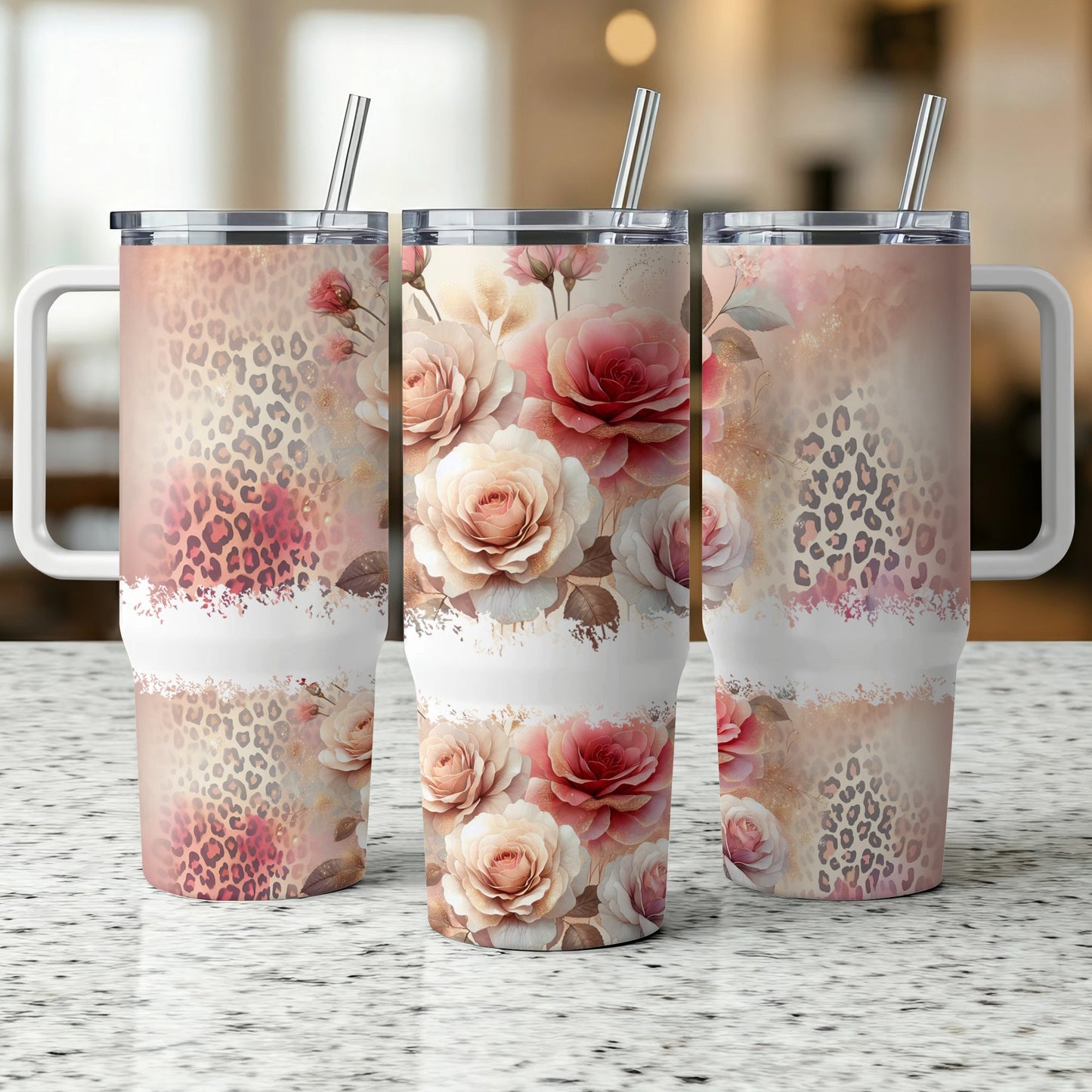 Three tumblers with floral and leopard print designs displayed on a counter.