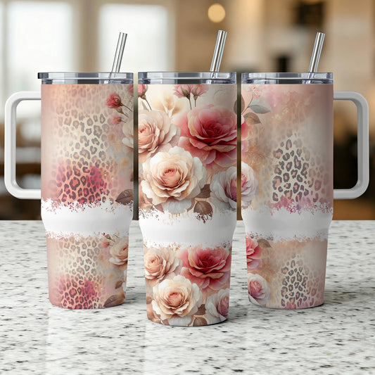 Three tumblers with floral and leopard print designs displayed on a counter.