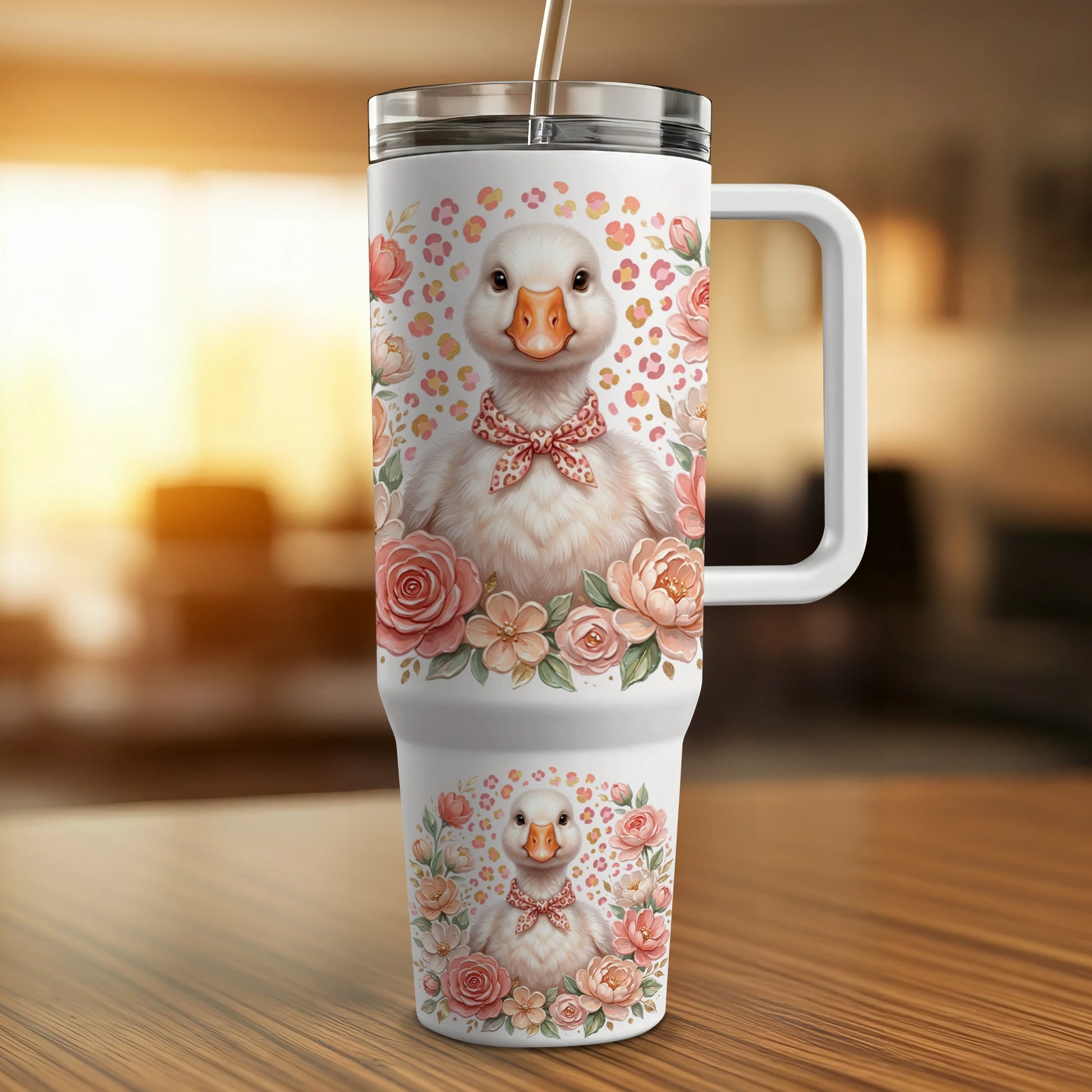White tumbler with a cute duckling wearing a pink bow and surrounded by flowers.