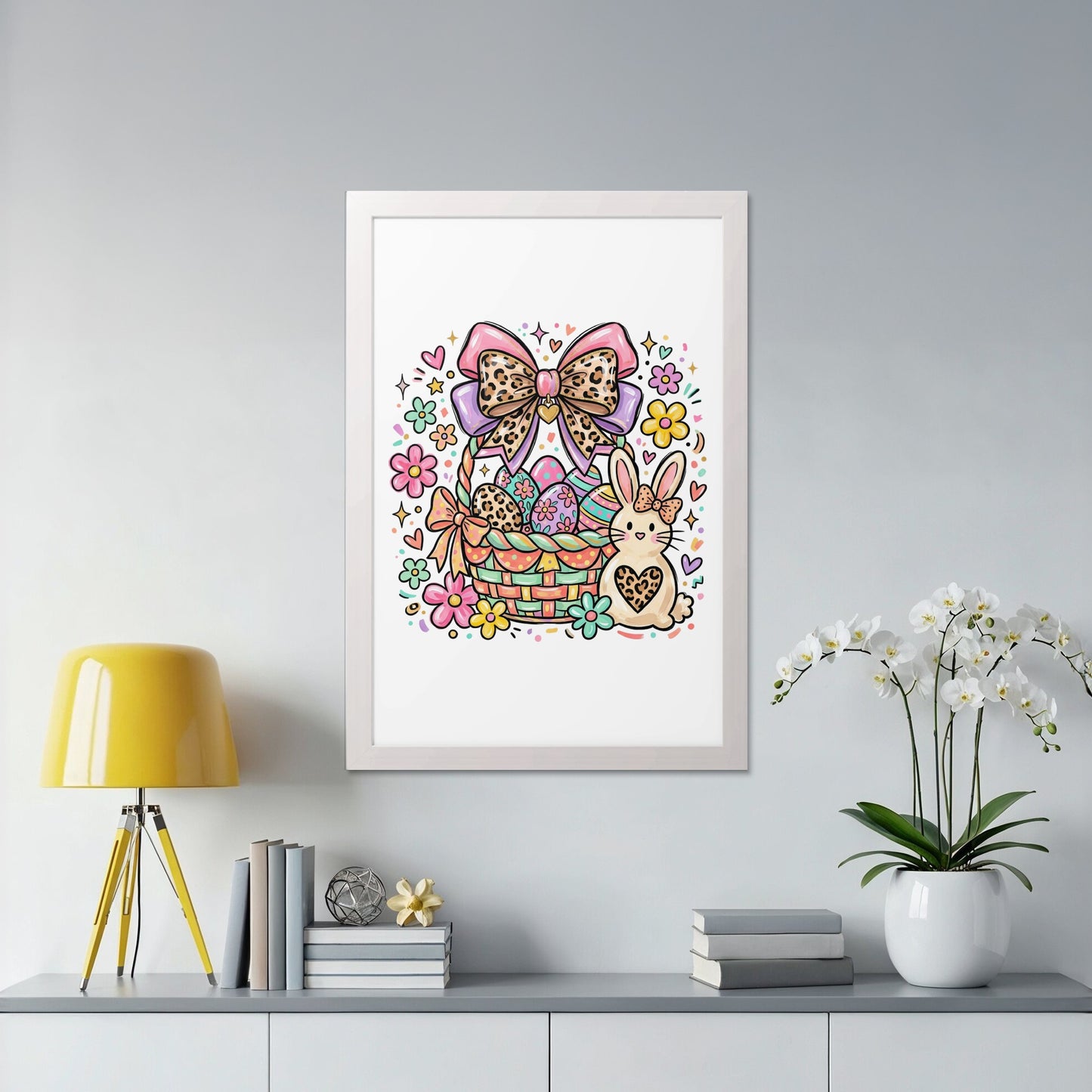 Easter basket with colorful eggs, bunny, and flowers in a framed picture.