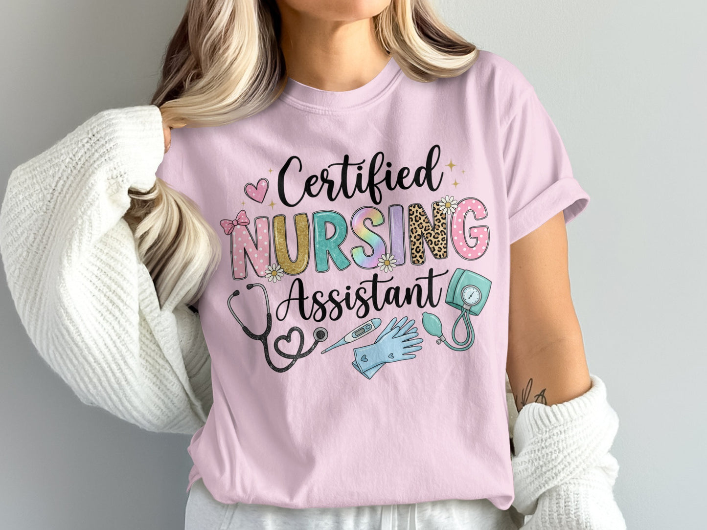 Pink t-shirt with "Certified Nursing Assistant" text and medical icons.