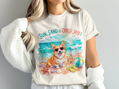 Corgi wearing sunglasses on beach with sandcastle and beach ball.