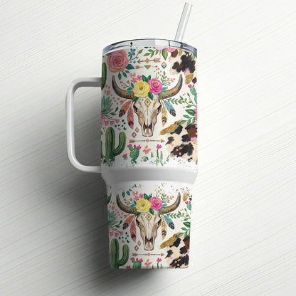 Tumbler with cow skull, floral, and cactus pattern.