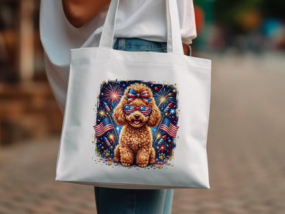 Cute poodle wearing sunglasses, with fireworks and American flags on a white tote bag.