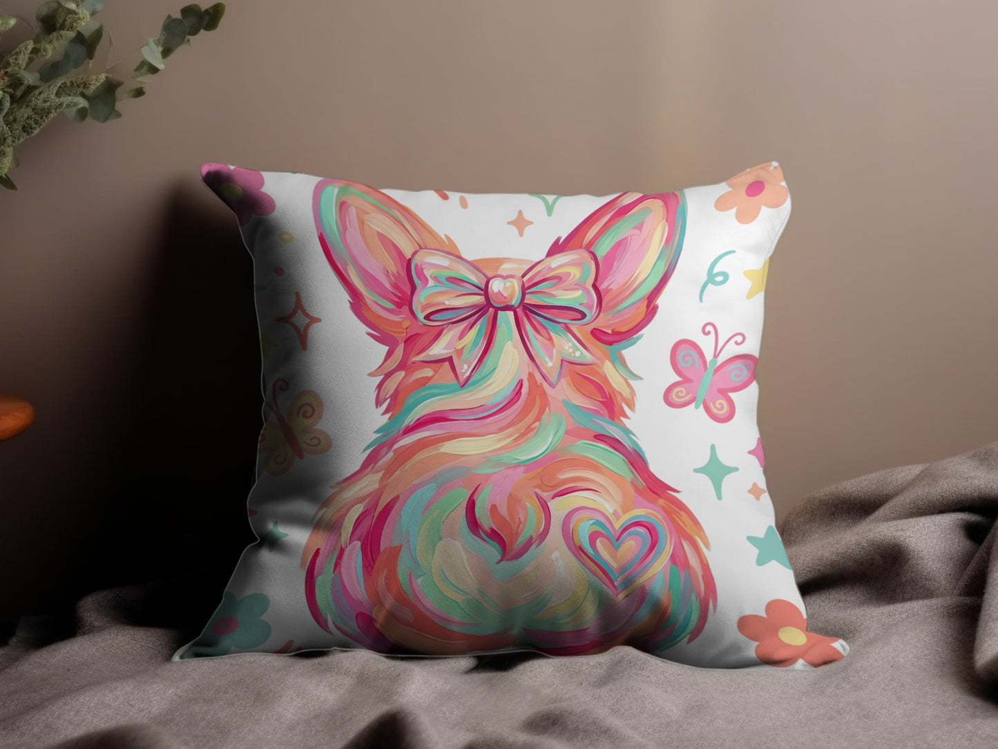 Decorative pillow with a colorful corgi, bow, heart, and butterflies.