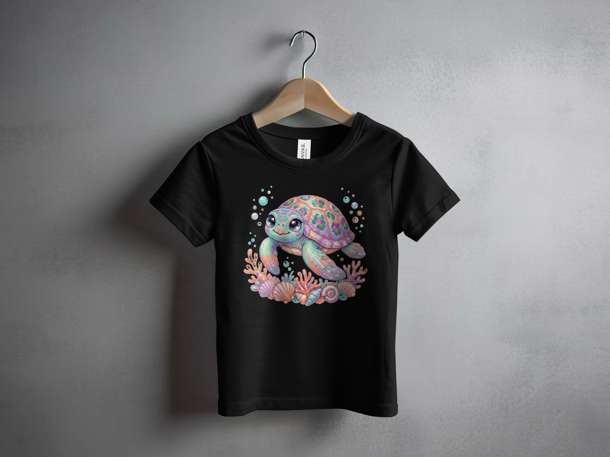 Black t-shirt with colorful cartoon sea turtle and coral graphic.