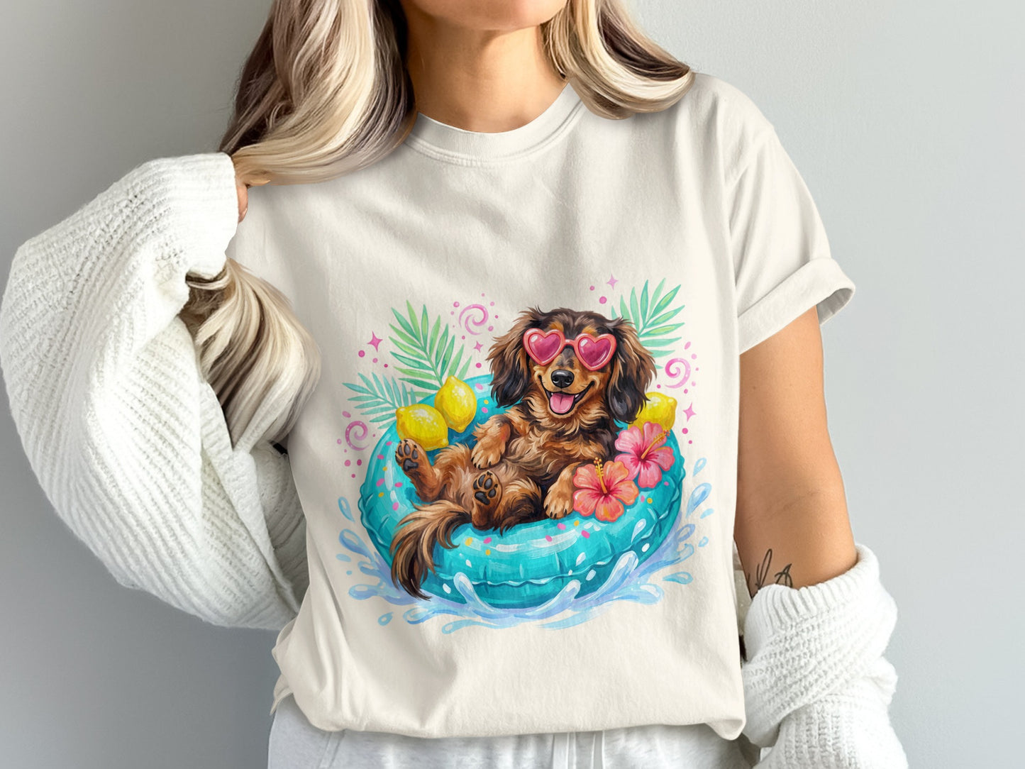 Dachshund in sunglasses floats in an inner tube with lemons and flowers.