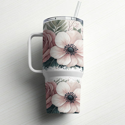 Tumbler with blush pink and white floral pattern and straw.