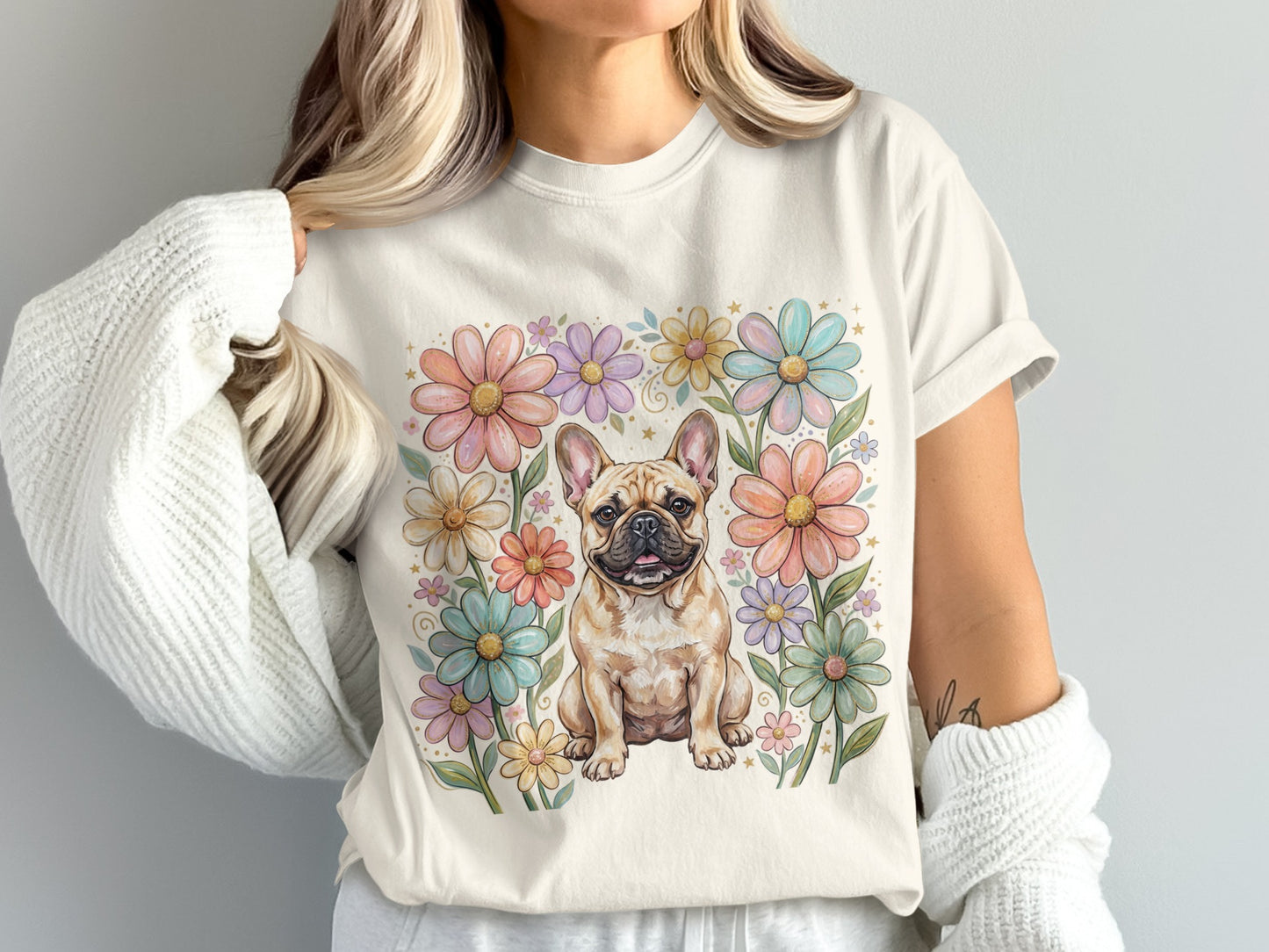 French bulldog surrounded by pastel flowers on a cream t-shirt.