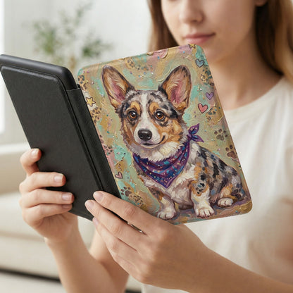 Corgi wearing bandana on a decorative case held by a person.