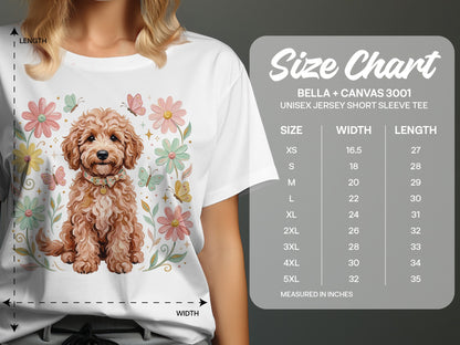White t-shirt with doodle dog, flowers, butterflies, and size chart.