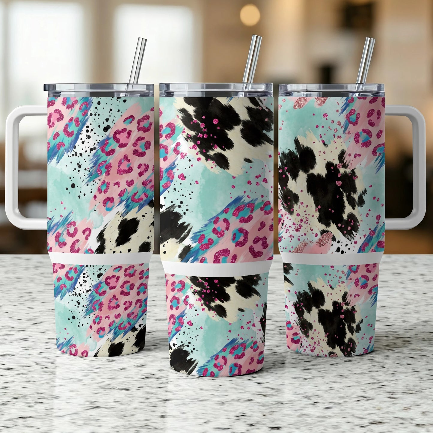 Three tumblers with colorful abstract animal print patterns.