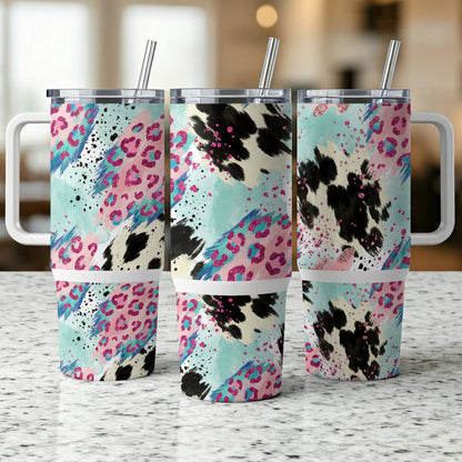 Three tumblers with colorful abstract animal print patterns.