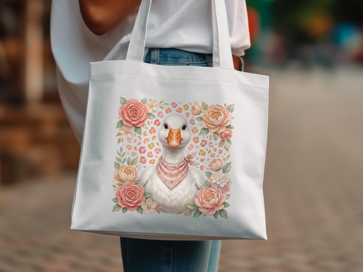 White tote bag with illustration of a duck wearing a bandana and surrounded by flowers.