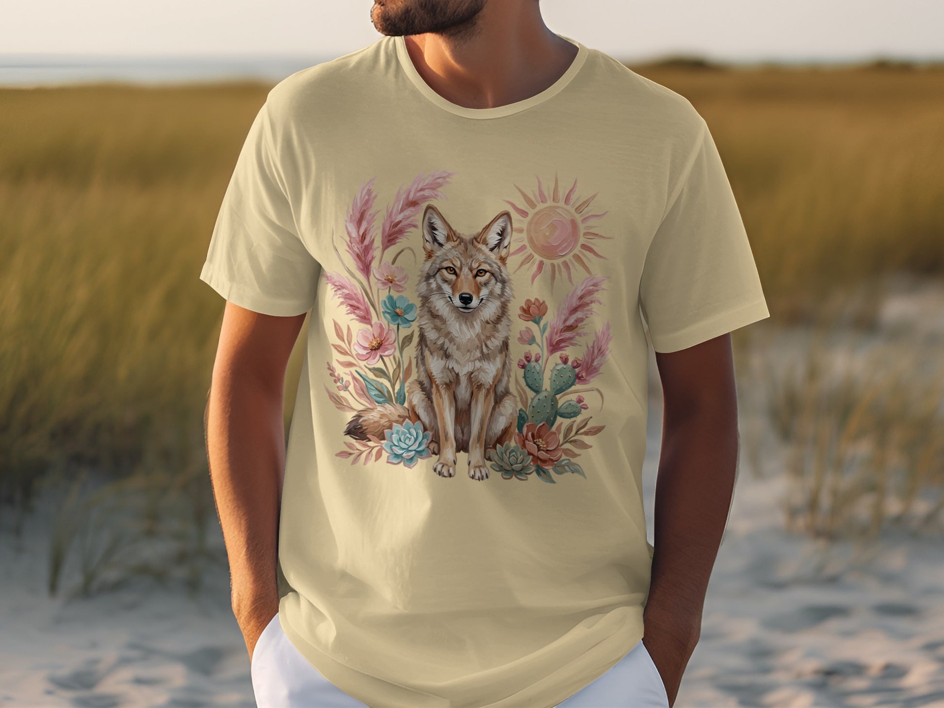 T-shirt with graphic of coyote, sun, cacti, and desert plants.