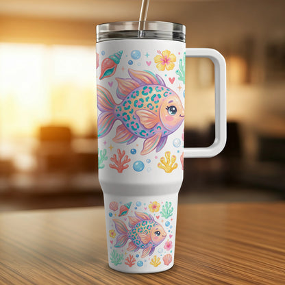 White tumbler with colorful cartoon fish and seashells.